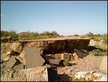 PUERTECITOS, MEXICO -- The road from San Felipe to Puertecitos, which was a paved road. This was the worst section of the road, which was washed out during the storm in September. There were many such washouts which necessitated the creation of detours along side the road, in the sand. These detours were well-traveled and posed no problems what so ever.