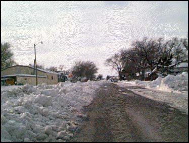 BUCKLIN, KS,  --  Here seemed to be the heart of the recent snowfall. None of the inhabitants appeared to be too put out by it but Highway 54 had been closed down during the storm. All along this stretch of the highway were indications of vehicles having driven off the road. There were even some vehicles that remained in the ditch.