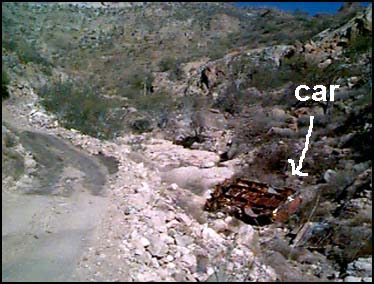 PUNTA EL MECHUDO, MEXICO -- Approaching the second of two monstrous climbs around Punta El Mechudo this burned out, overturned, automobile carcass which lay at the bottom of the arroyo seemed an apt image to illustrate the fate a navigational misstep would ensure.