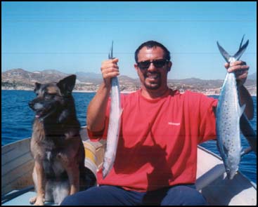 PLAYA PALMILLA, SAN JOSE DEL CABO, MEXICO --Paco held up three sierra mackerels caught from the little aluminum boat.  Turns out we both made ceviche with our catch.